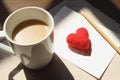 Red love hearts on brown paper note with a cup of coffee. Royalty Free Stock Photo