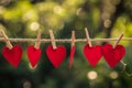 red love hearts pegged onto a clothes line outdoors Royalty Free Stock Photo