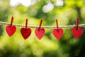 red love hearts pegged onto a clothes line outdoors