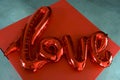 Red love letters valentine day gift balloon gel air top view Royalty Free Stock Photo