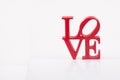 Red love letters on white background on the right Royalty Free Stock Photo