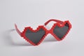 Red love pixel glasses on white background