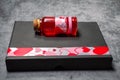 Red love potion in a glass stopper bottle