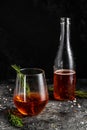 Red low alcohol drink, chilled colorful beverages on rustic black background. summer party. Alcoholic drink concept. Freeze motion