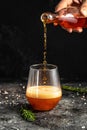 Red low alcohol drink, chilled colorful beverages on rustic black background. summer party. Alcoholic drink concept. Freeze motion