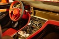 Red luxury car Interior. Steering wheel, shift lever and dashboard. Shallow doff Royalty Free Stock Photo