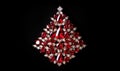 Red luxury Christmas tree made of precious stones, diamonds and ruby on black background. Luxury greeting card with red shine gem Royalty Free Stock Photo