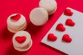 Red Macarons and red shaped hearts Royalty Free Stock Photo