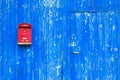 Red mail box on textured wall Royalty Free Stock Photo