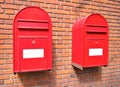 Red mail boxes on brick wall Royalty Free Stock Photo