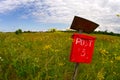 Red mail post box in a field Royalty Free Stock Photo