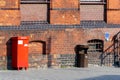 Red mailbox on a red brick wall Royalty Free Stock Photo