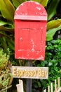 Red mailbox with brown wood with espresso plate background Royalty Free Stock Photo