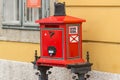 Traditional European post in the form of a red mailbox Royalty Free Stock Photo