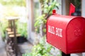 Red mailbox in front of the house Royalty Free Stock Photo