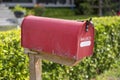 Red mailbox on modern house