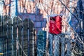 Red mailbox on a wooden fence Royalty Free Stock Photo