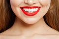 Red makeup Lips with trendy color tint lipstick. Beautiful female smile and perfect white teeth Royalty Free Stock Photo