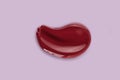Red makeup smear texture of lip gloss balm