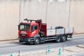 Red Man crane truck circulating along the Ronda litoral de Barcelona
