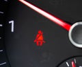 Red man on the dashboard in the car. The concept of an unfastened seat belt in a car, the safety of the driver and passenger.