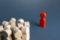 Red man stands aside from crowd of people. Asocial. Integration into society. Self-isolation, contagious. Socialization. A Royalty Free Stock Photo