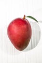 Healthy food red mango fruit has leaf on white table background Royalty Free Stock Photo