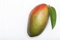 Healthy food red mango fruit has leaf on white table background Royalty Free Stock Photo