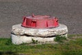 Red manhole cover of fire hydrant Royalty Free Stock Photo