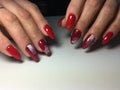 red manicure with white snowflakes on long nails