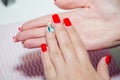 Red manicure, women handle