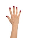 Red manicured female open hand gesture number five fingers up