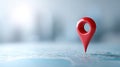 A red map pin is stuck in a blue background, symbolizing navigation and location services Royalty Free Stock Photo