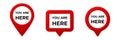 Red map pointers with you are here text displayed inside each symbol Royalty Free Stock Photo
