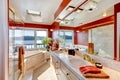 Red and marble interior of large luxury master bathroom with glass shower, and jacuzzi tub. Royalty Free Stock Photo