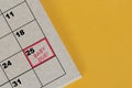 Red mark on the calendar at 25 for reminder of baby due date. Royalty Free Stock Photo