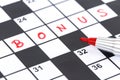 Red marker on Crossword - Bonus Royalty Free Stock Photo