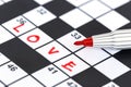 Red marker on Crossword - Love