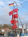 Red marker flags for a fisherman\'s fish traps in the wind