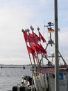 Red marker flags for a fisherman\'s fish traps fluttering in the wind