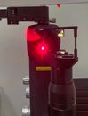 The red marker light of a YAG laser is on In an ophthalmologist office