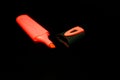 Red marker pen and cap isolated on black close-up Royalty Free Stock Photo