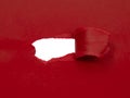 Red marsala paper damaged torn with white hole isolated copyspace for text