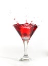 Red martini cocktail splashing Royalty Free Stock Photo