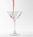 Red martini cocktail splashing Royalty Free Stock Photo