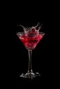 Red martini cocktail splashing Royalty Free Stock Photo