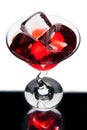Red martini glass with ice cubes Royalty Free Stock Photo