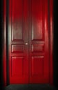 Red massive vintage doors indoor.