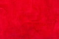 Red matte background of suede fabric, closeup. Velvet texture of seamless wine leather. Royalty Free Stock Photo