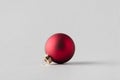 Red matte Christmas ball on a seamless grey background